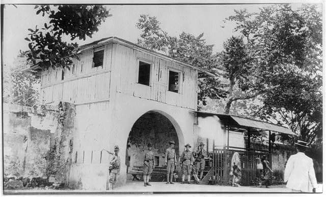 Historical photograph of people standing at the gate at Jolo